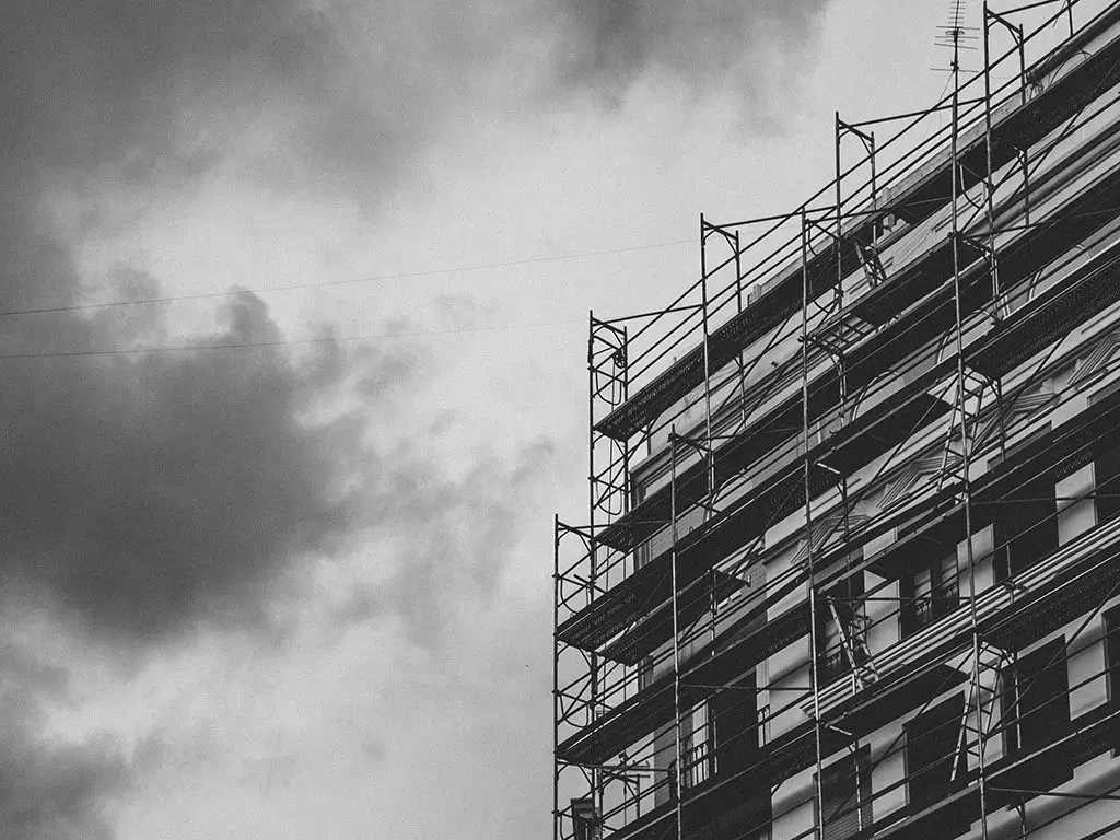 a tall building with scaffolding on it's sides