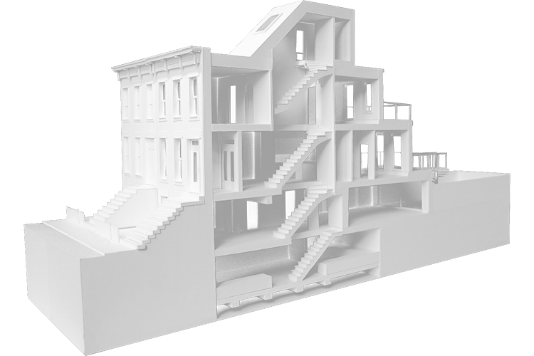 a white model of a house with stairs