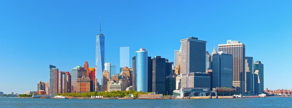 a large body of water with buildings in the background