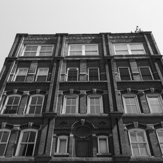 an old building with many windows and balconies