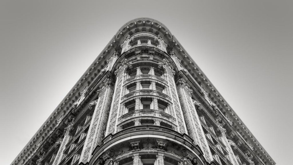 a very tall building with many windows and balconies