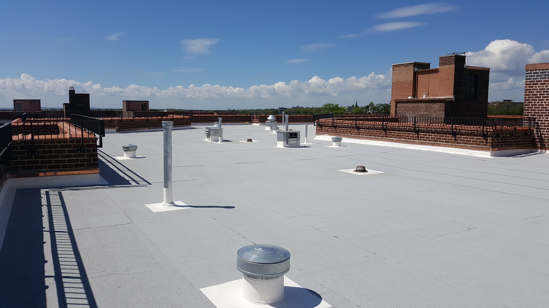 the roof of a building with many chimneys