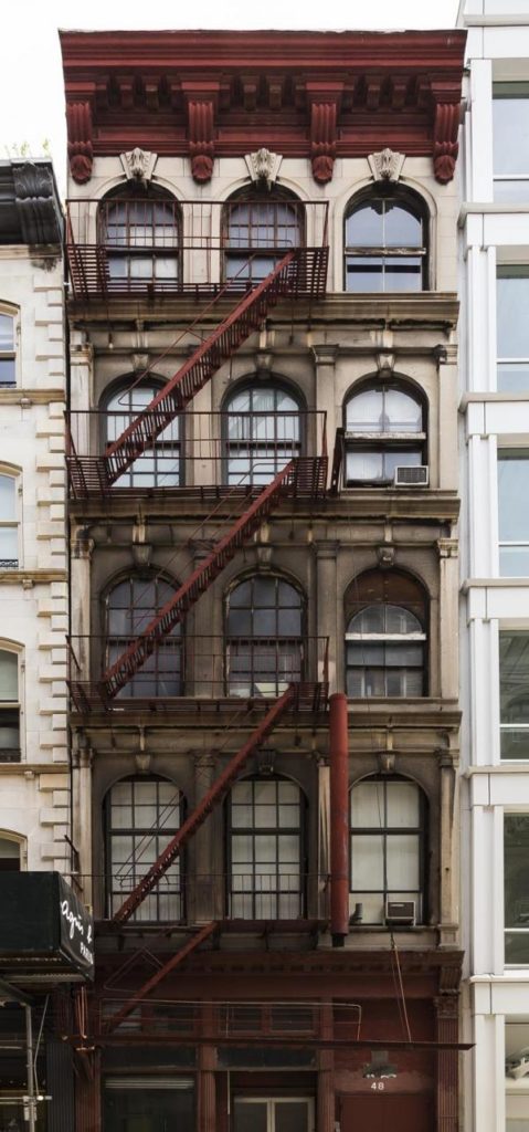 an old building with a fire escape on the side