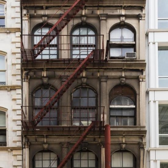 an old building with a fire escape on the side