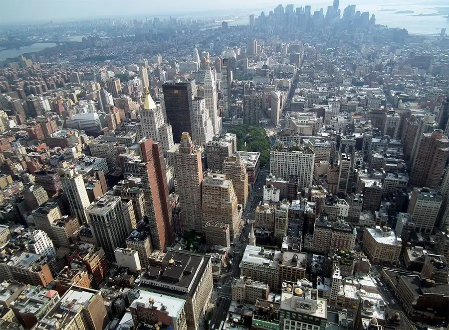 an aerial view of a city with tall buildings