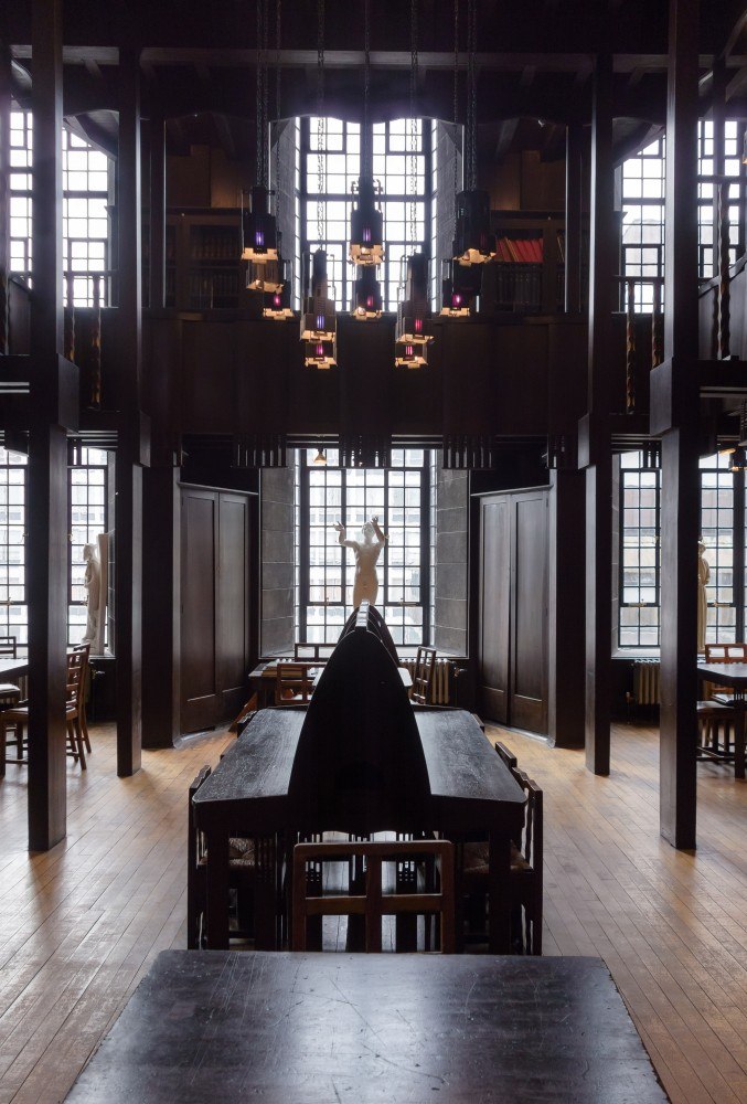 a large room with many windows and tables