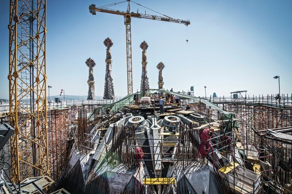 a construction site with lots of cranes and scaffolding