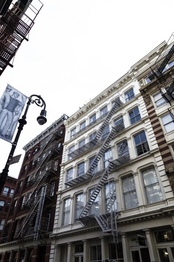 a fire escape next to a tall building