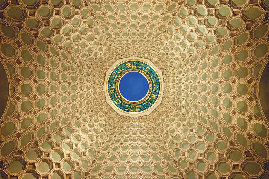 the ceiling in a building has a circular design on it