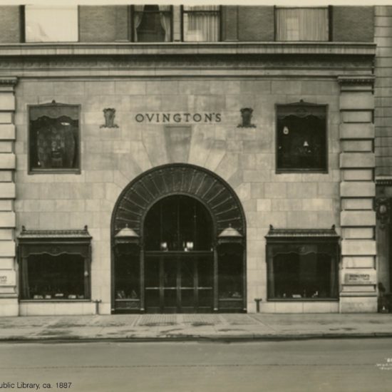 an old photo of a building in the city