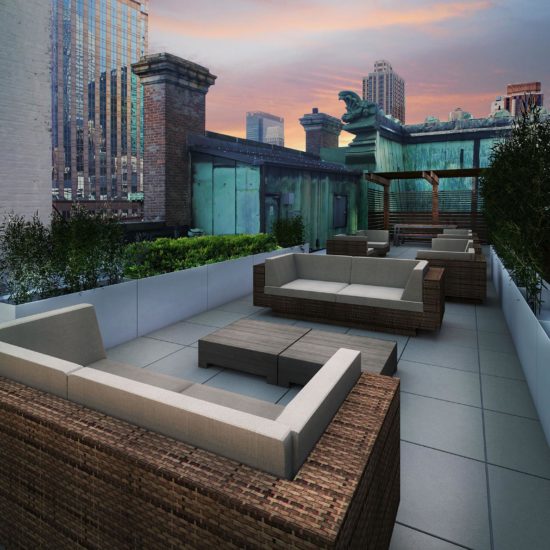 an outdoor seating area with city skyline in the background