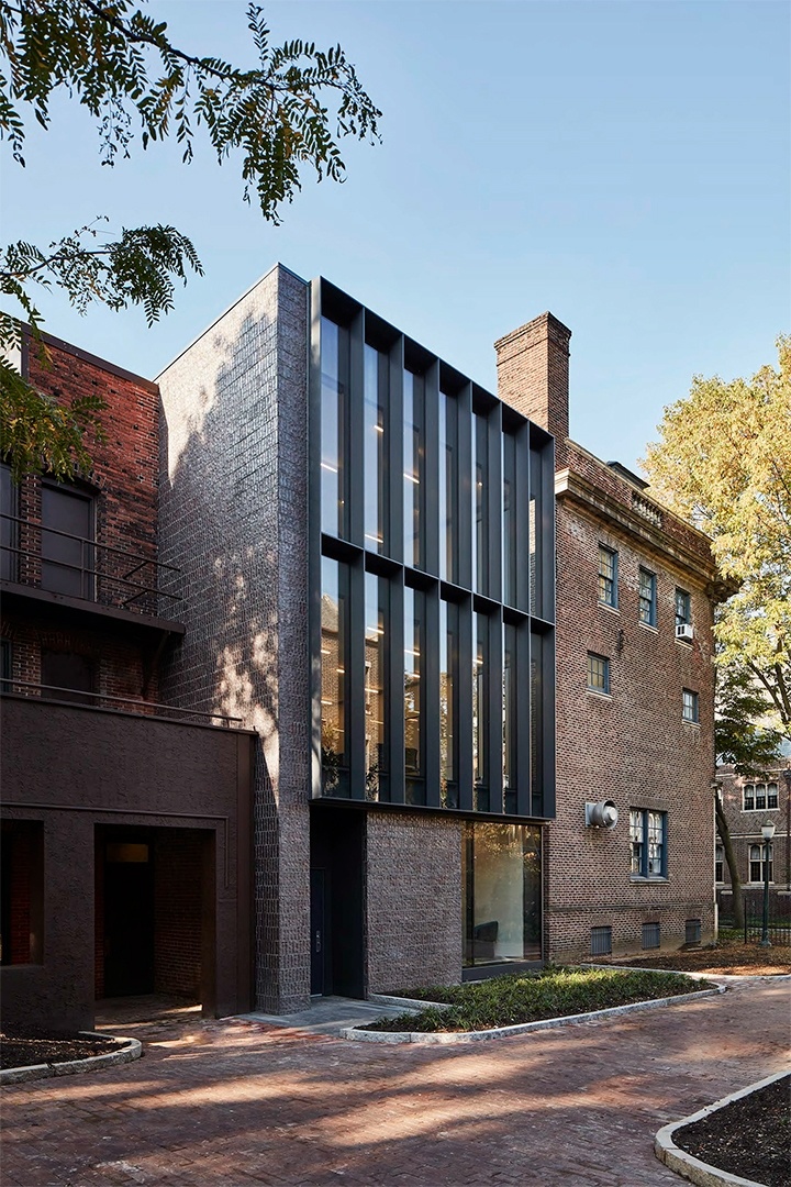 a brick building with many windows on it