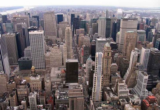 an aerial view of a city with tall buildings