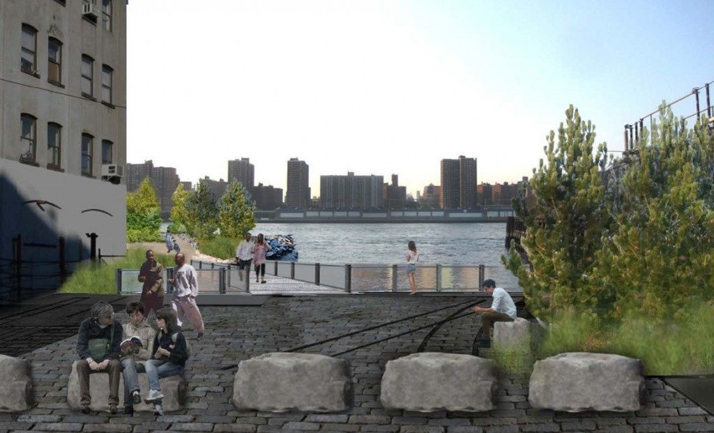 a group of people sitting next to a river