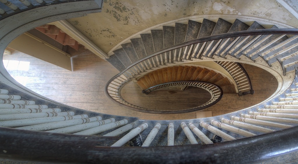 a spiral staircase in an old building