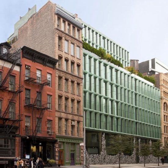 a row of buildings with people walking on the sidewalk