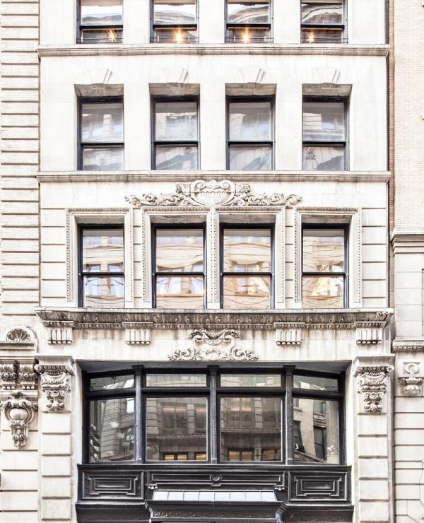 an old building with a bench in front of it