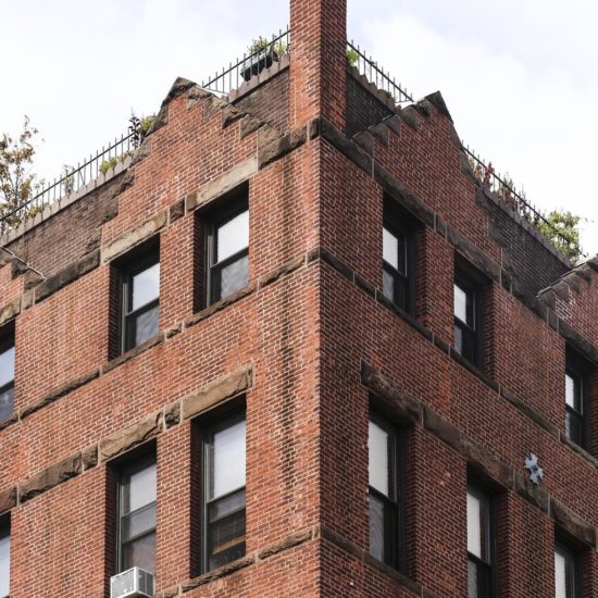 a tall brick building with lots of windows