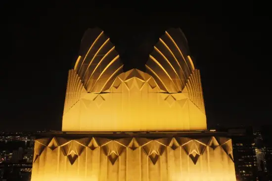 a large building lit up at night with lights