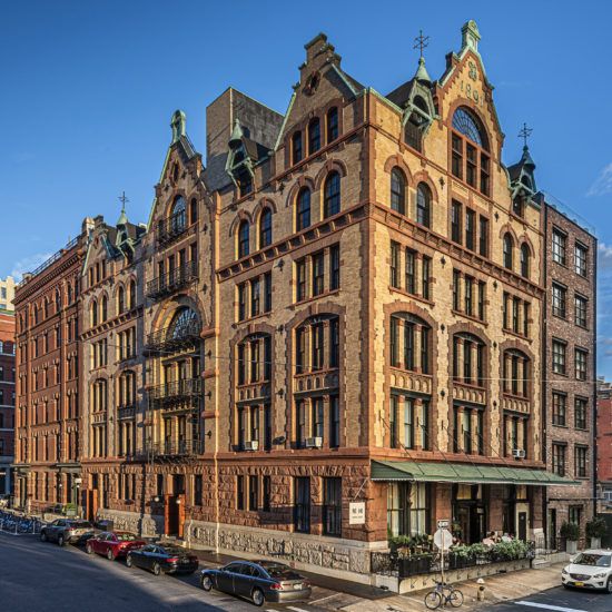 a large building with many windows and a clock on it