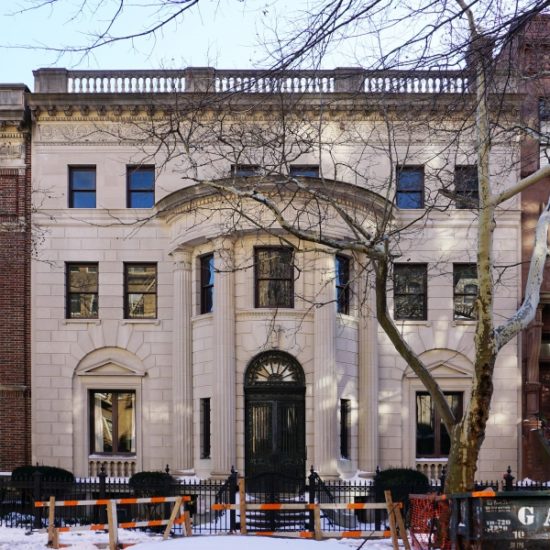 a large white building with a black door