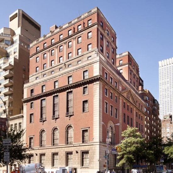 an old brick building on the corner of a street