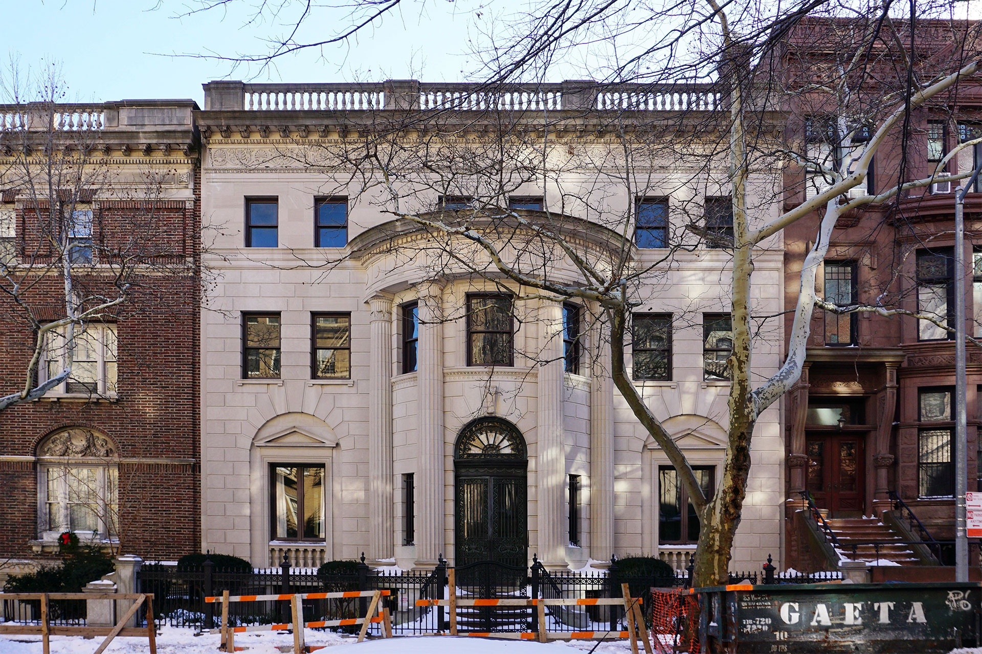 a large white building with a black door