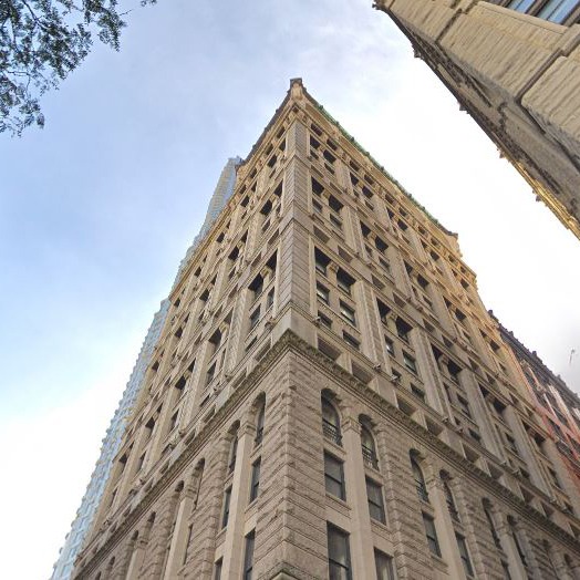 a very tall building with a sky background