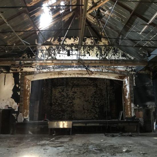 an old building with some rust on the ceiling