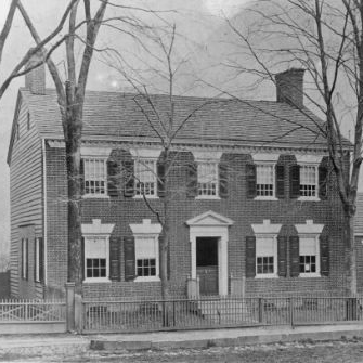 an old black and white photo of a house