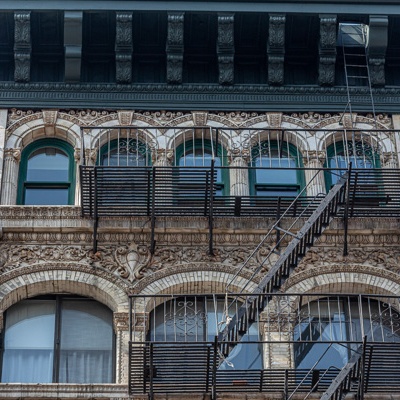 an old building with many windows and stairs