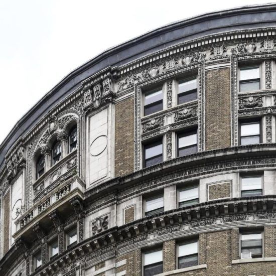 a large building with a clock on the side of it