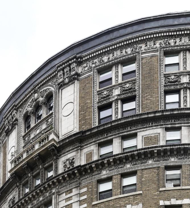 a large building with a clock on the side of it