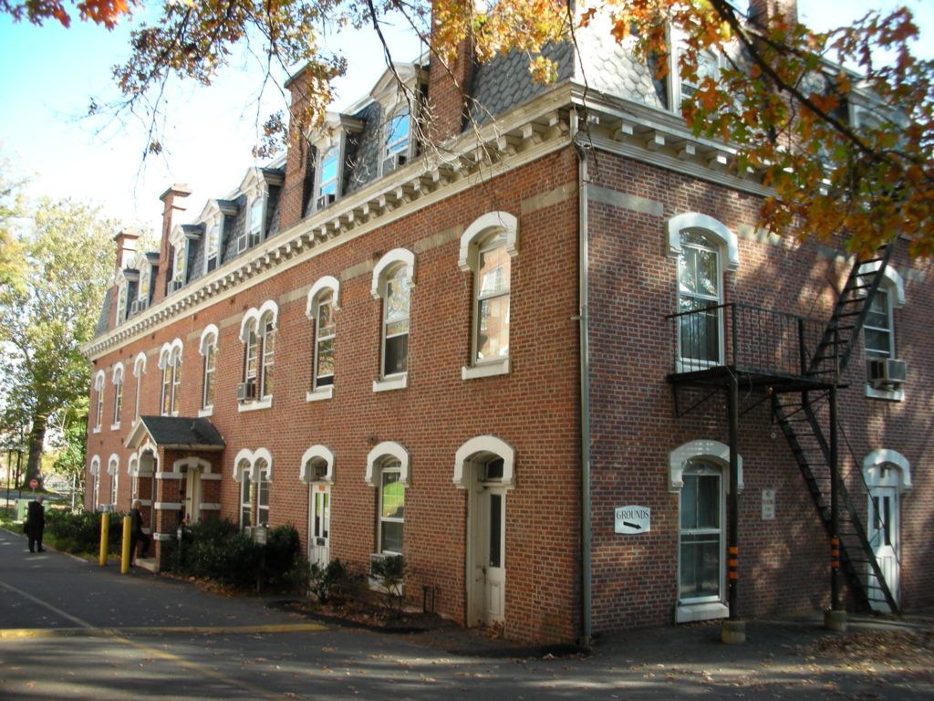 an old brick building on the corner of a street