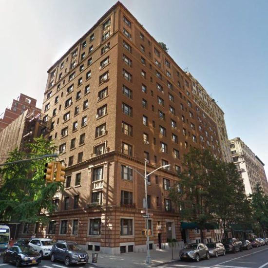 a large brown building sitting on the corner of a street