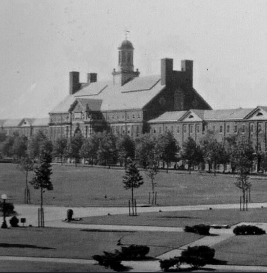 an old black and white photo of a large building