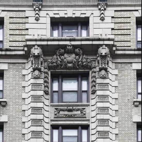 an old building with ornate carvings on the windows