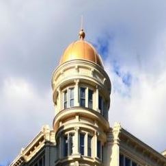 a large building with a golden dome on top