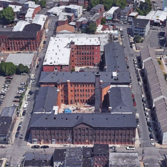 an aerial view of a large building with many windows