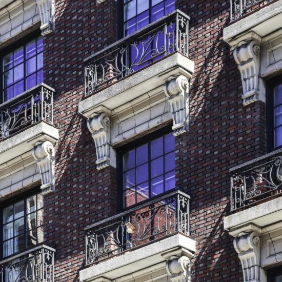 a building with many windows and balconies