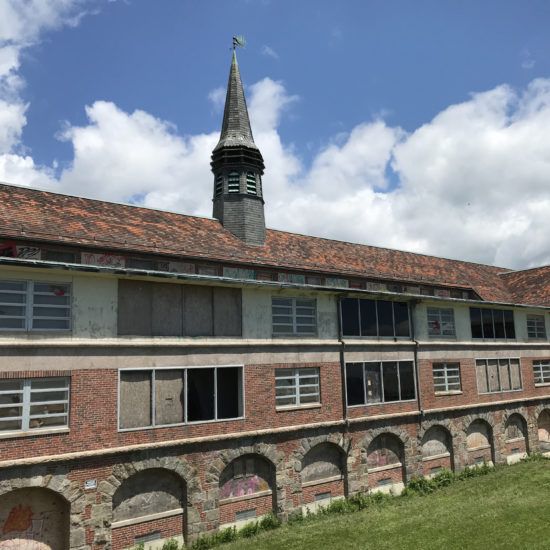 an old building with a steeple on top