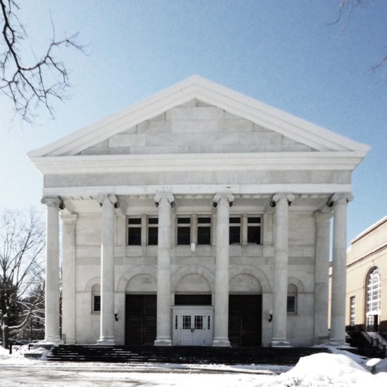 a large white building with columns and pillars