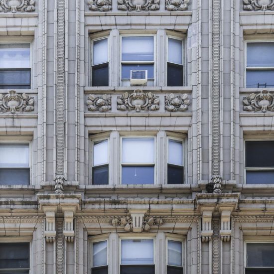 an old building with many windows and ornate decorations