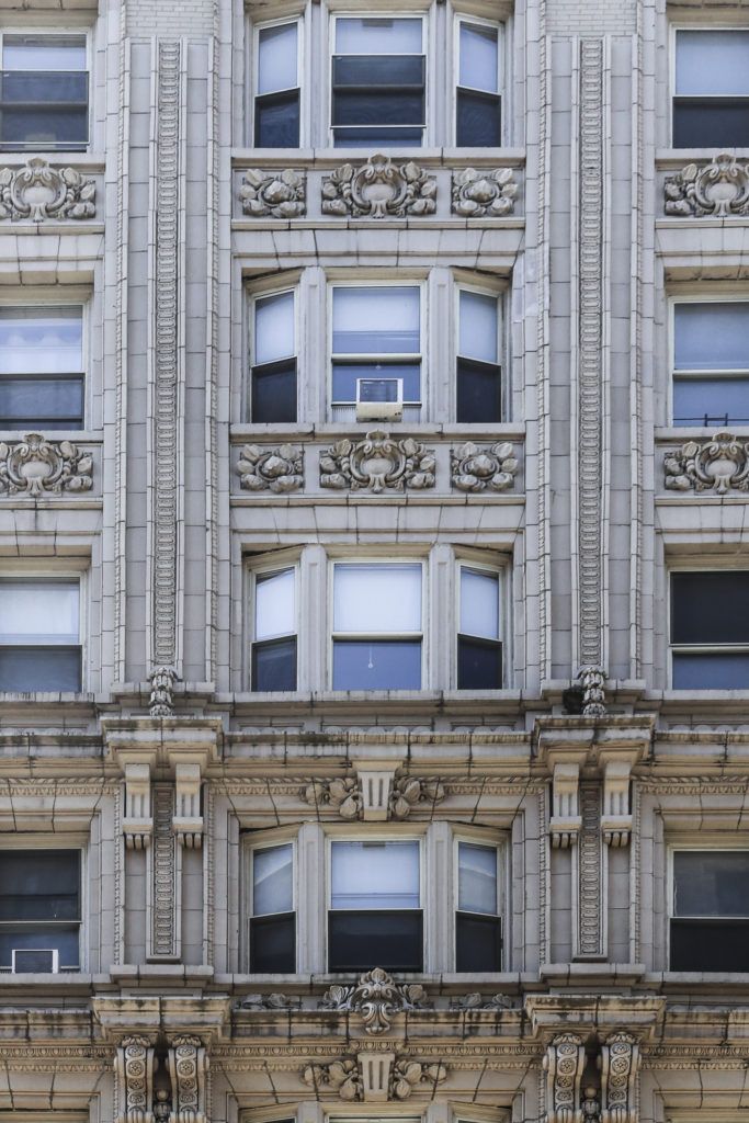 an old building with many windows and ornate decorations