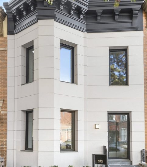 a white house with black trim and windows