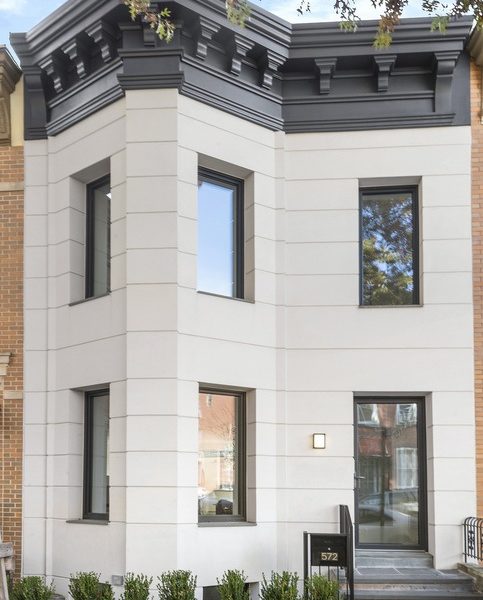 a white house with black trim and windows