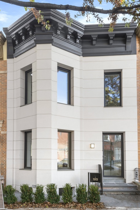 a white house with black trim and windows