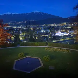Dispatch From Innsbruck: International Passive House Conference 4 a view of a city at night from a hill