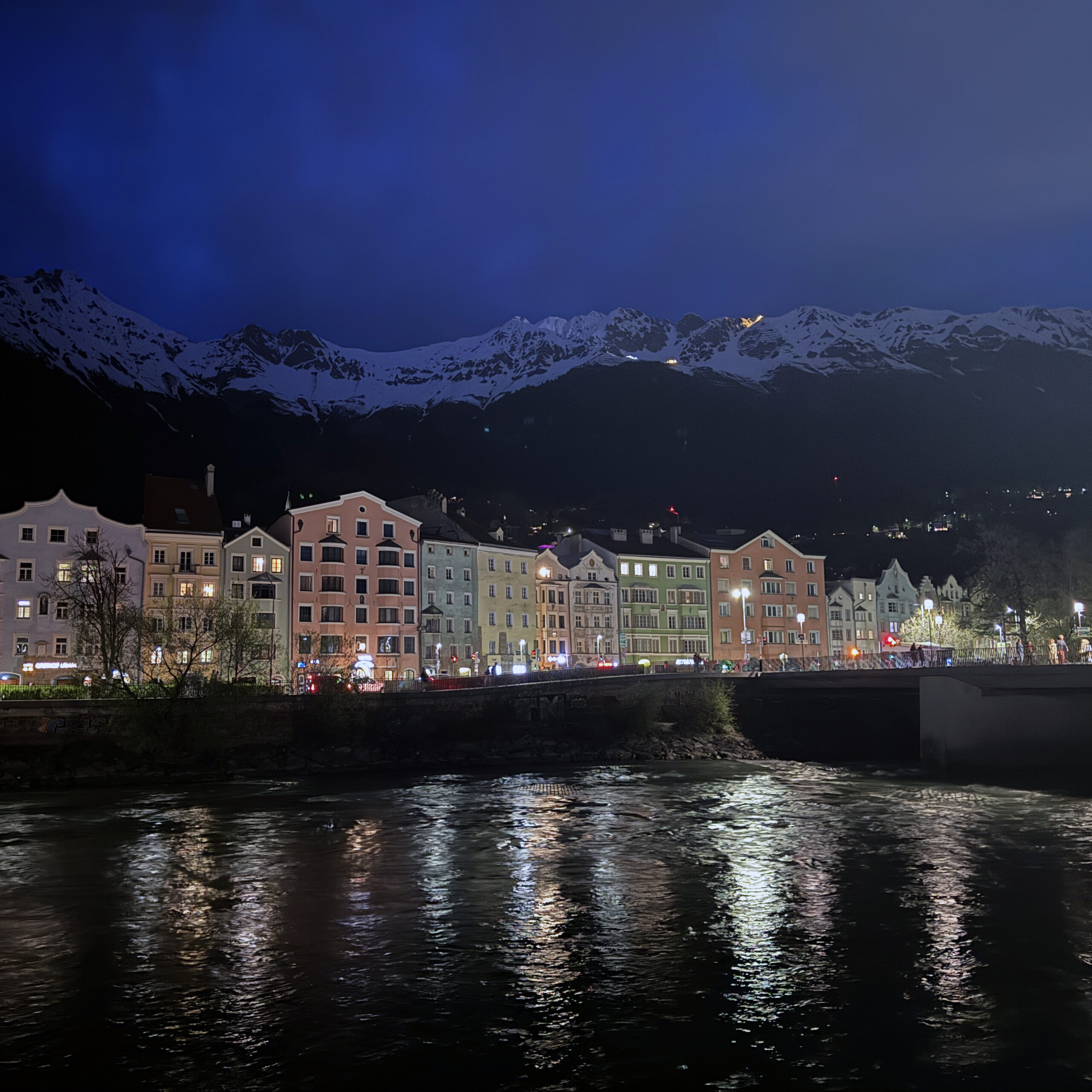 a river running through a city at night