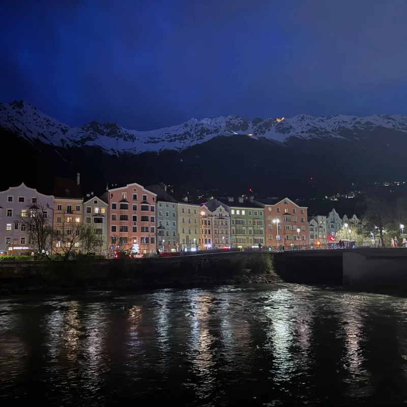 a river running through a city at night